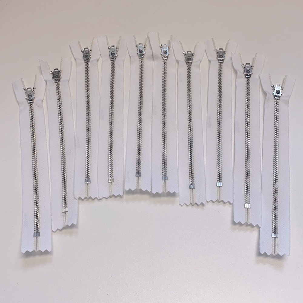 White closed metal zippers